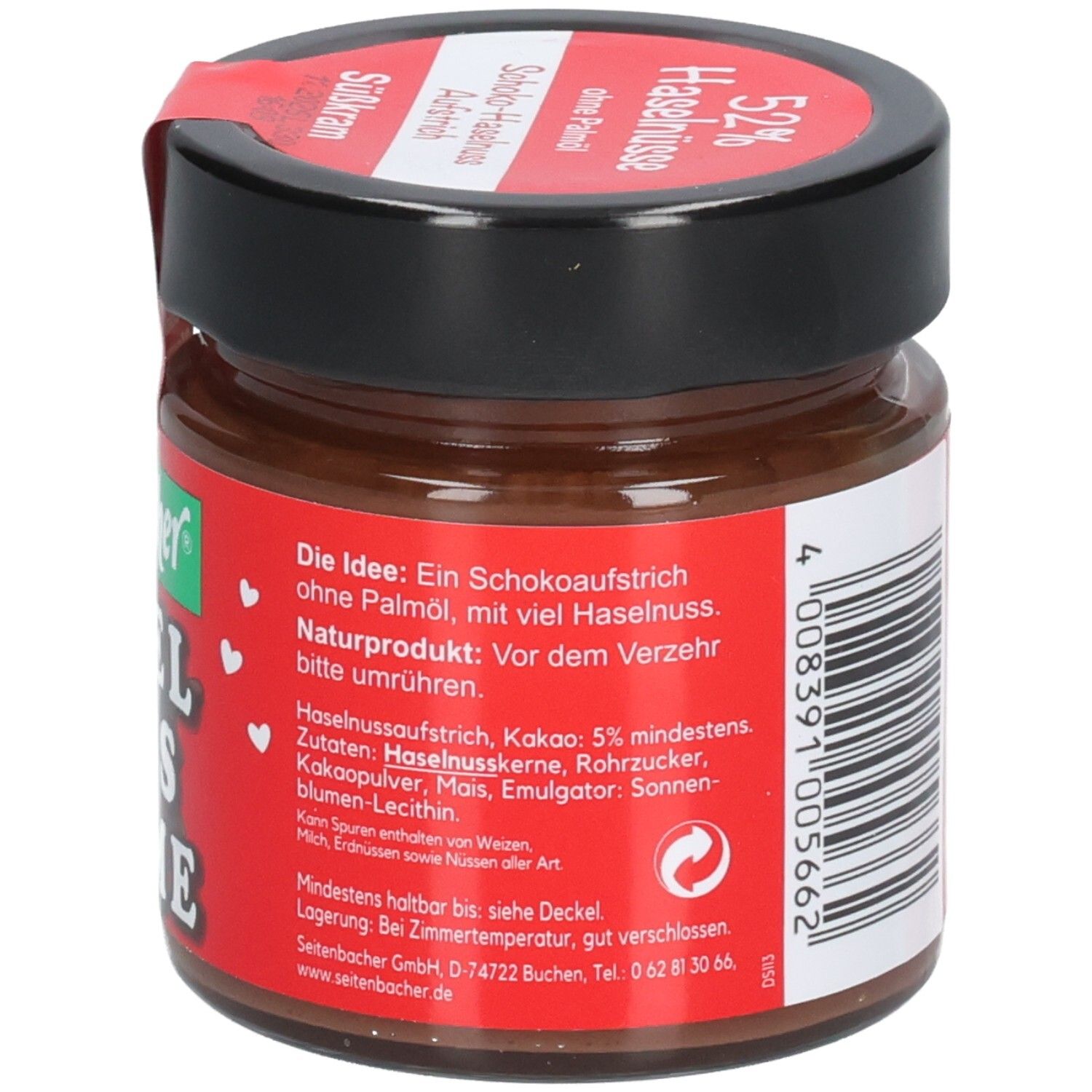 Pot de crème au chocolat et aux noisettes. Étiquette rouge avec ingrédients et informations nutritionnelles. Marque: Seitenbacher. Couvercle noir.
