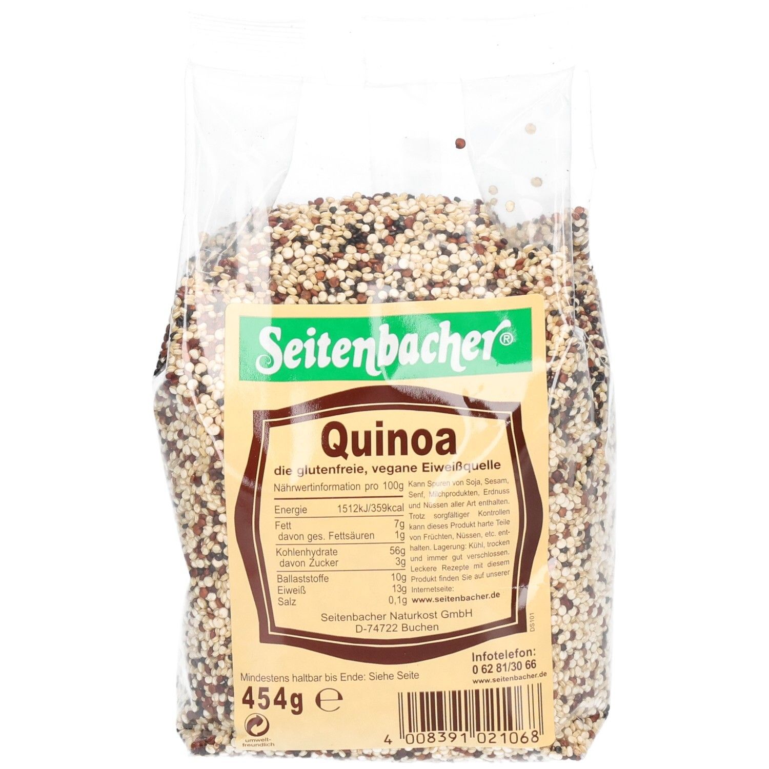 Sachet transparent de quinoa. Inscription: Seitenbacher, Quinoa, informations nutritionnelles, 454g. Grains multicolores.
