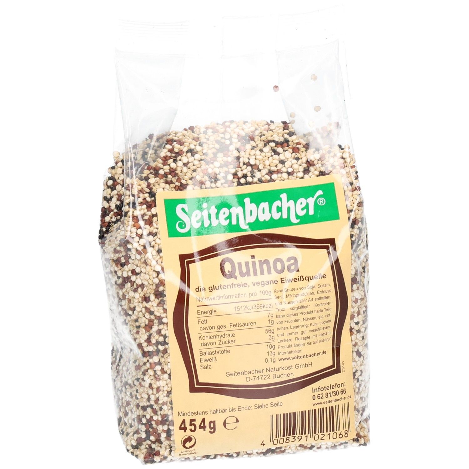Sachet de quinoa en biais. Inscription: Seitenbacher, Quinoa, informations nutritionnelles, 454g. Grains multicolores.
