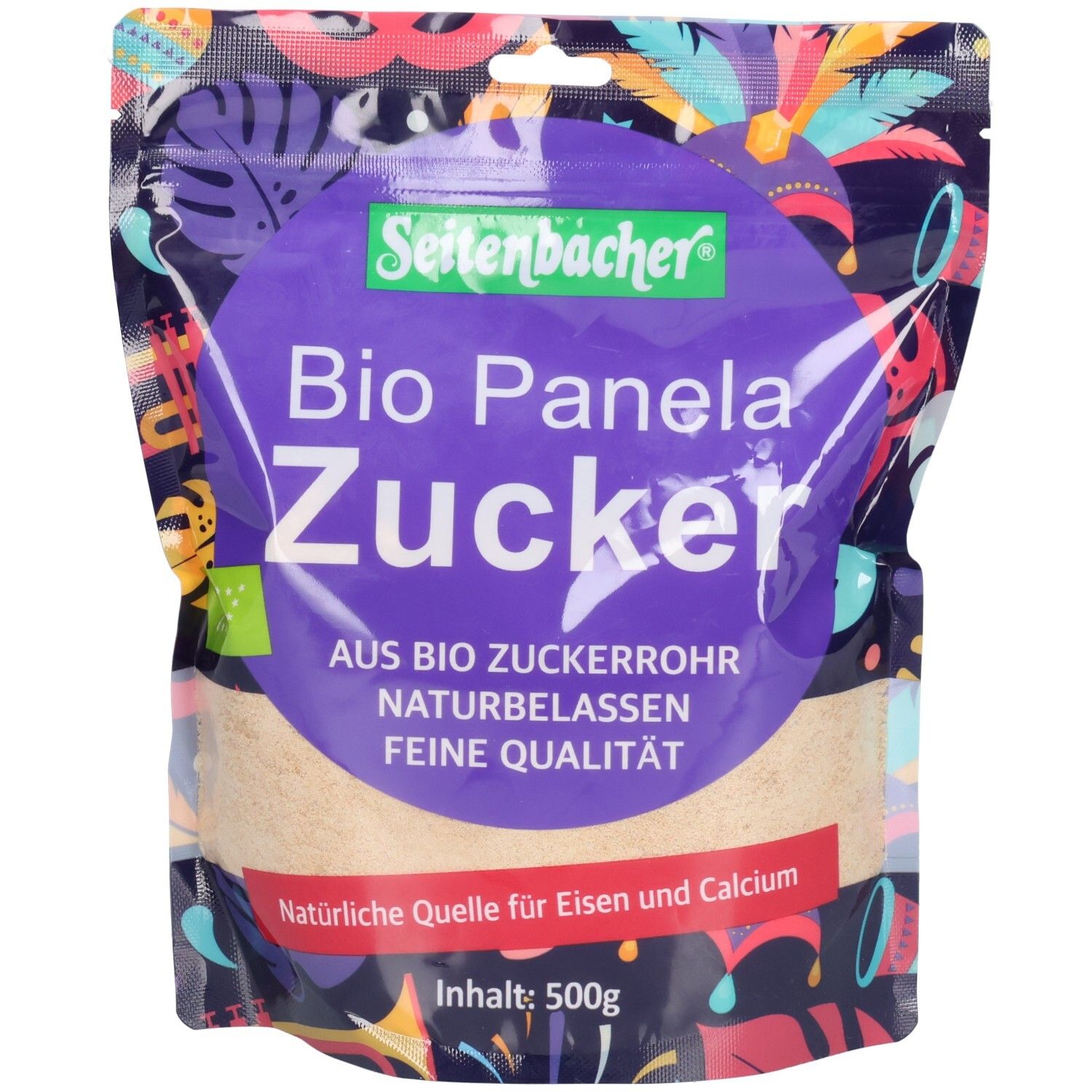 Sachet de sucre de canne complet bio Seitenbacher. Cercle violet avec nom du produit. Label bio. Contenu : 500g.