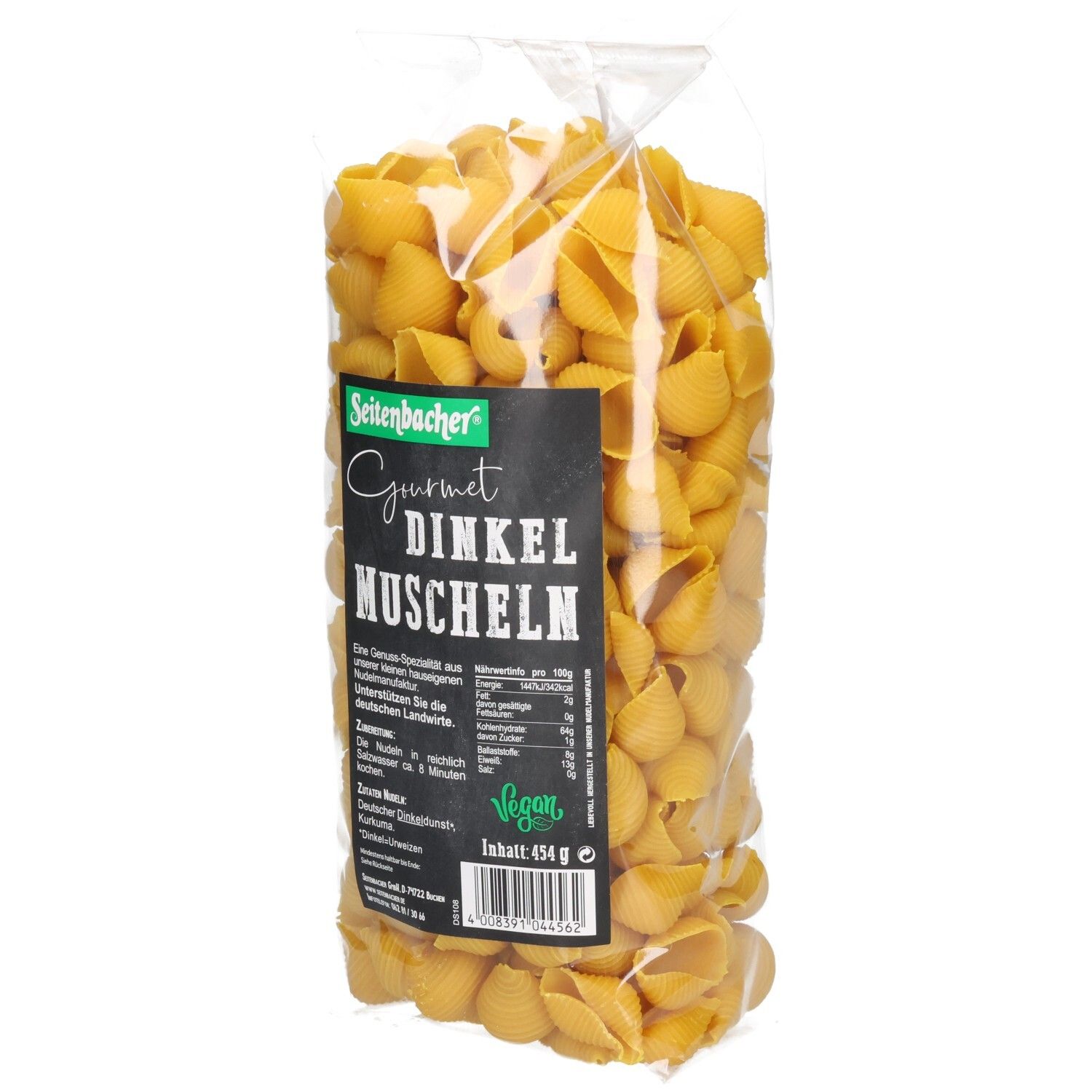 Klarsichtbeutel mit Seitenbacher Dinkel Muscheln. Schwarzes Etikett mit Produktinformationen. Vegan-Siegel.