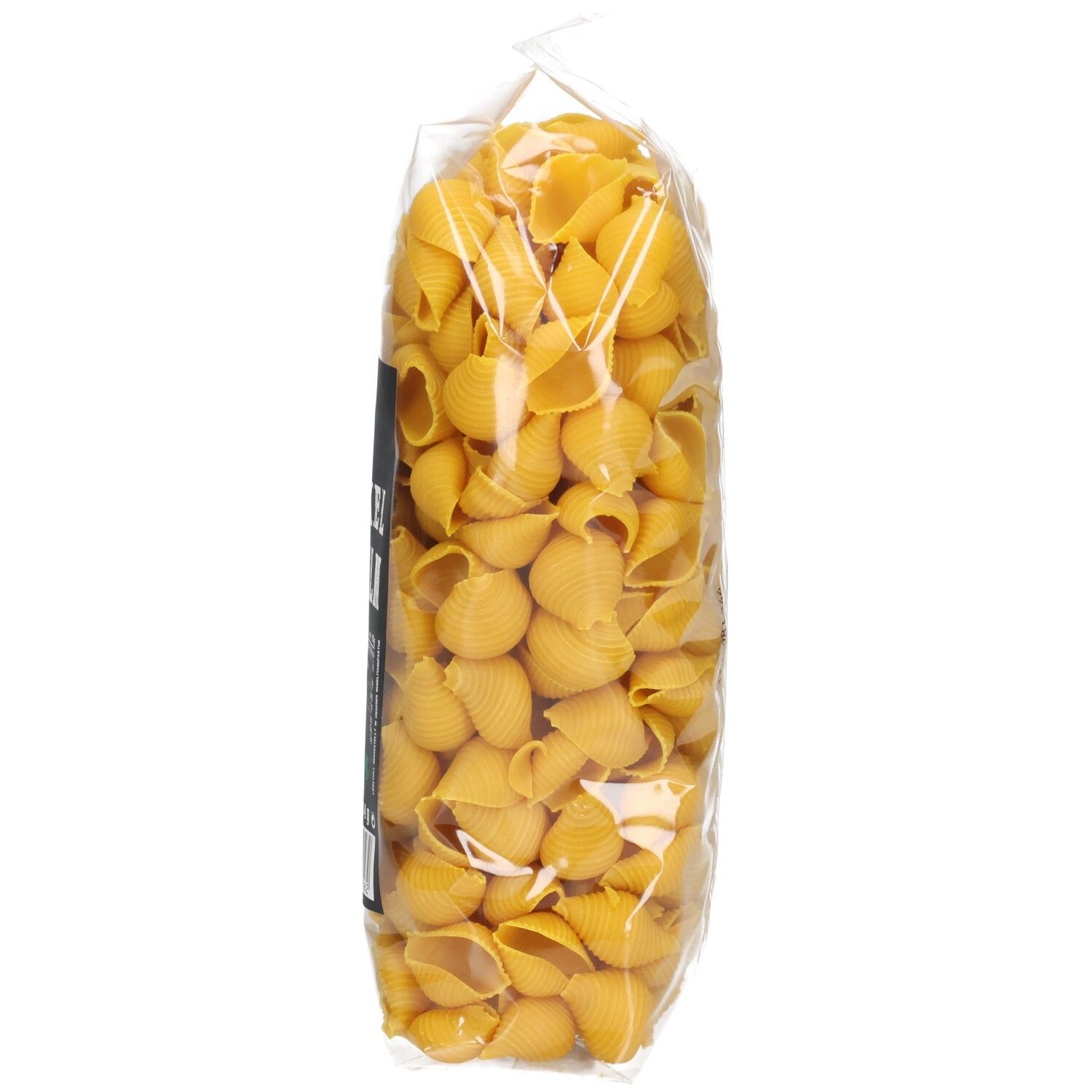 Klarsichtbeutel mit Seitenbacher Dinkel Muscheln, Seitenansicht. Schwarzes Etikett mit Produktinformationen.