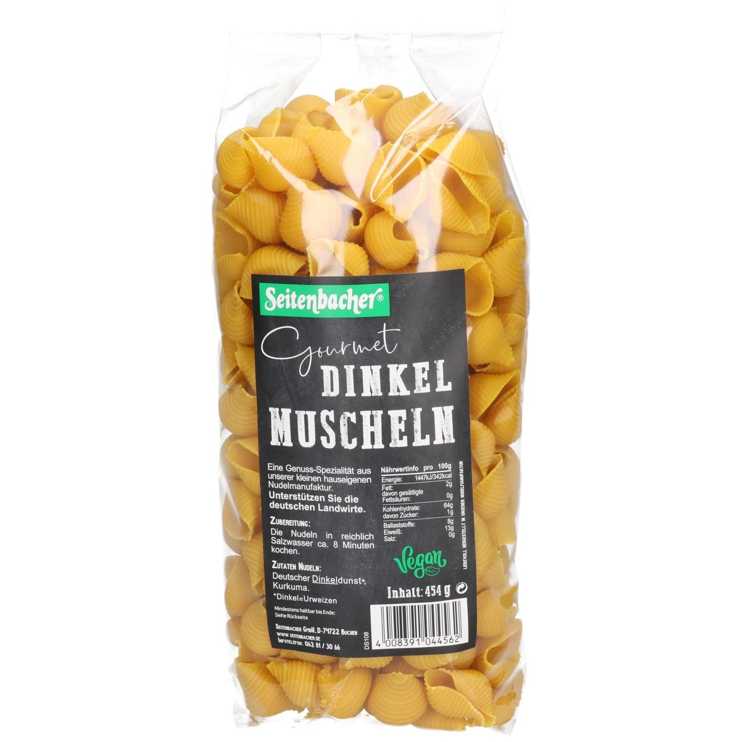Klarsichtbeutel mit Seitenbacher Dinkel Muscheln. Schwarzes Etikett mit Produktinformationen. Vegan-Siegel.