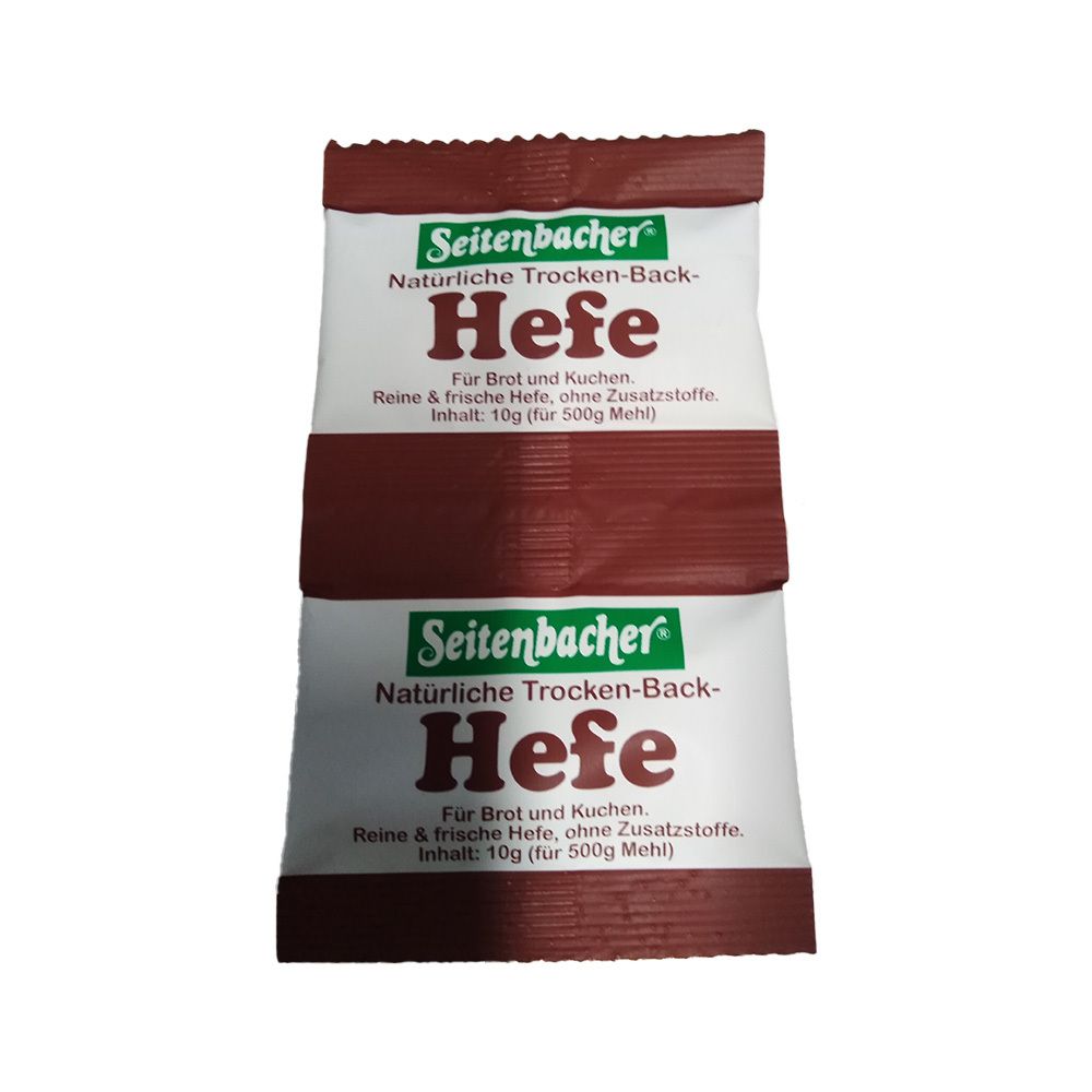 Deux sachets de levure Seitenbacher. Emballage blanc et marron avec nom et texte du produit. Inscription : Levure pure et fraîche, sans additifs.