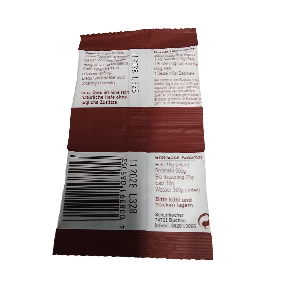 Dos de deux sachets de levure Seitenbacher. Emballage marron avec texte et code-barres. Texte : Machine à pain, ingrédients, conserver au frais et au sec.