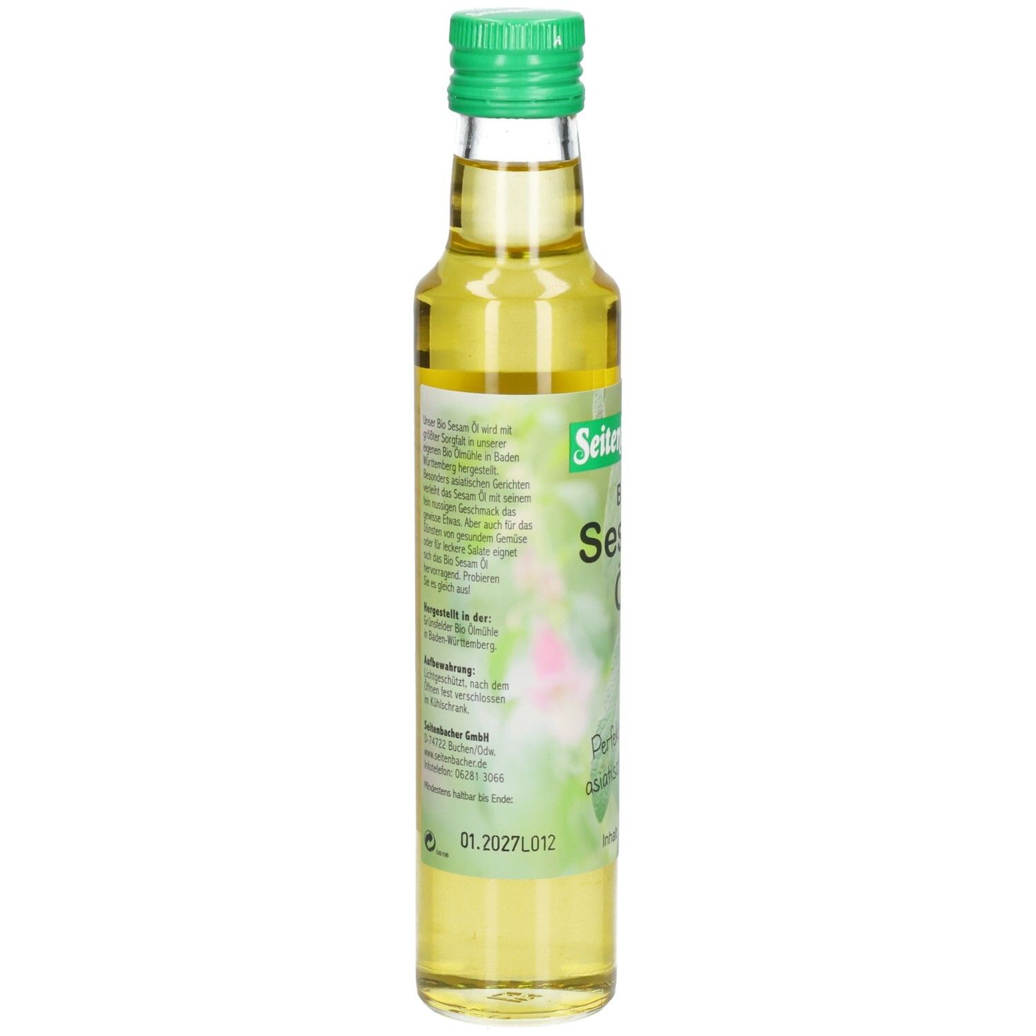 Bouteille en verre avec bouchon vert. Étiquette avec texte et motif floral.