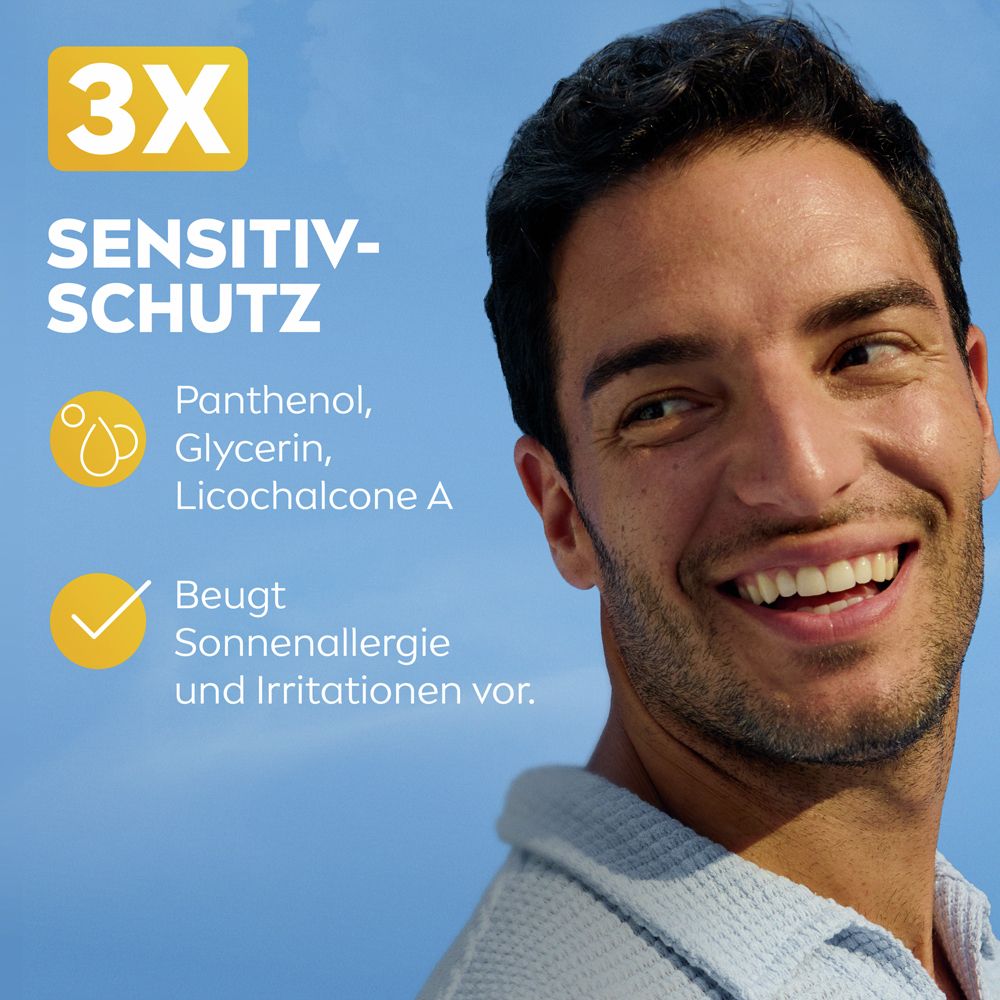 Homme souriant. 3x Protection Sensibilité. Contient Panthénol, Glycérine, Licochalcone A. Prévient l'allergie solaire.