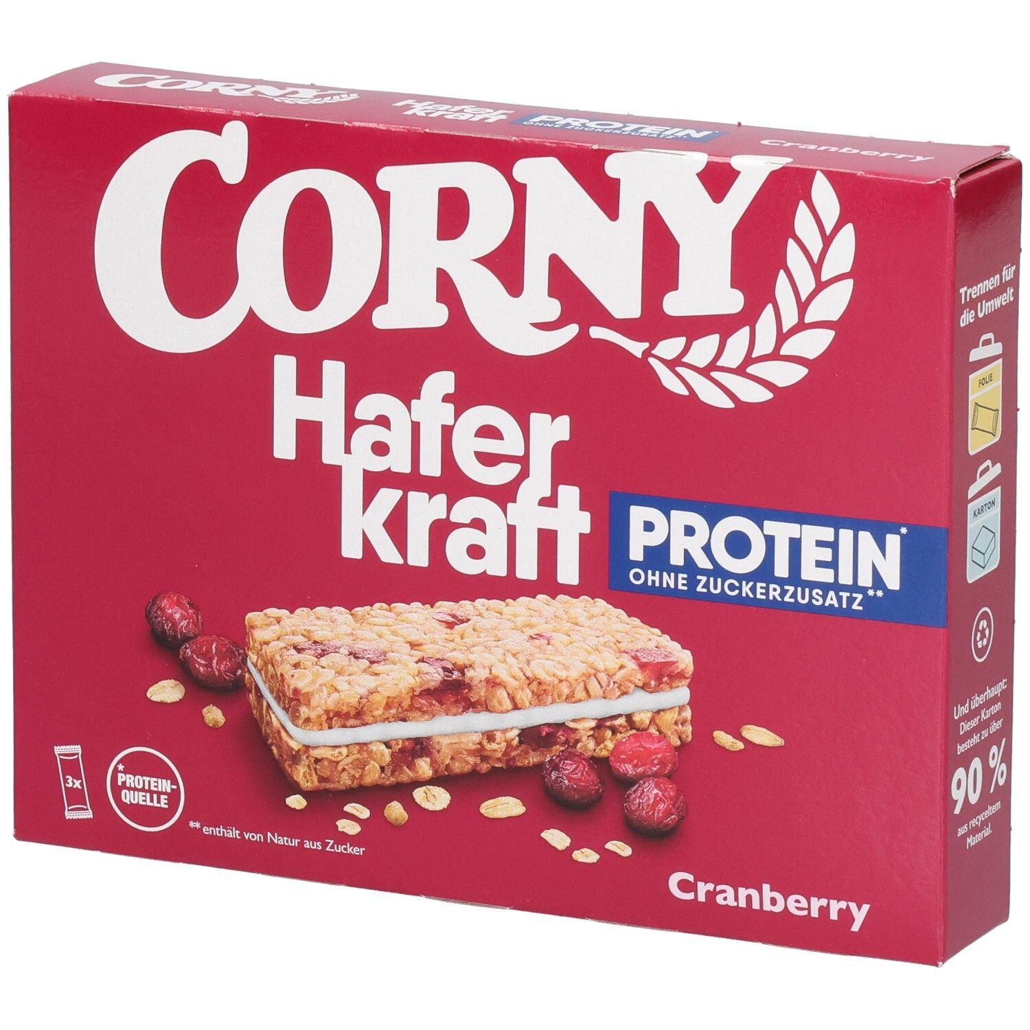 Boîte rouge Corny Haferkraft Protein Cranberry. Barre et canneberges illustrées. Texte : Protéines, sans sucre ajouté.
