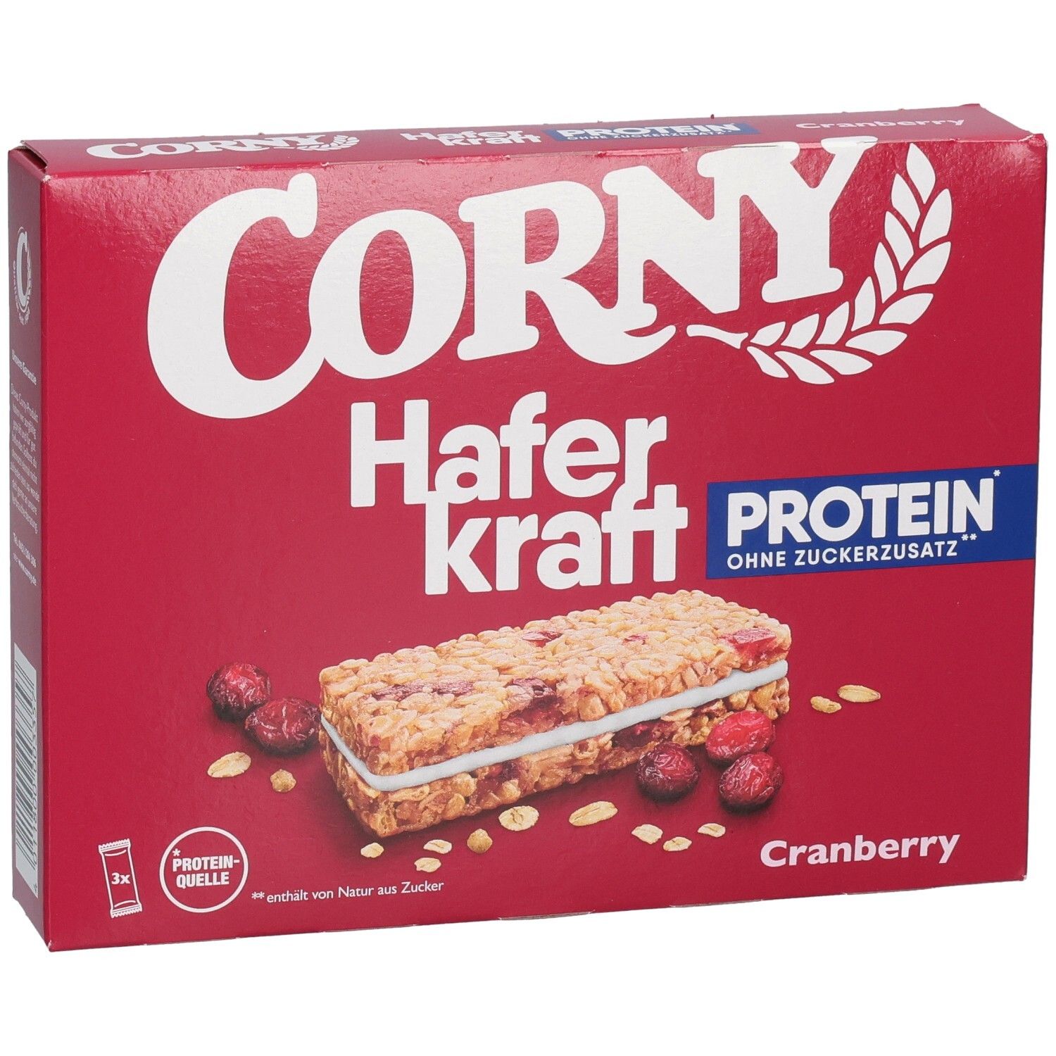 Boîte rouge Corny Haferkraft Protein Cranberry. Illustré : barre, canneberges et flocons d'avoine. Texte : Protéines, sans sucre ajouté.