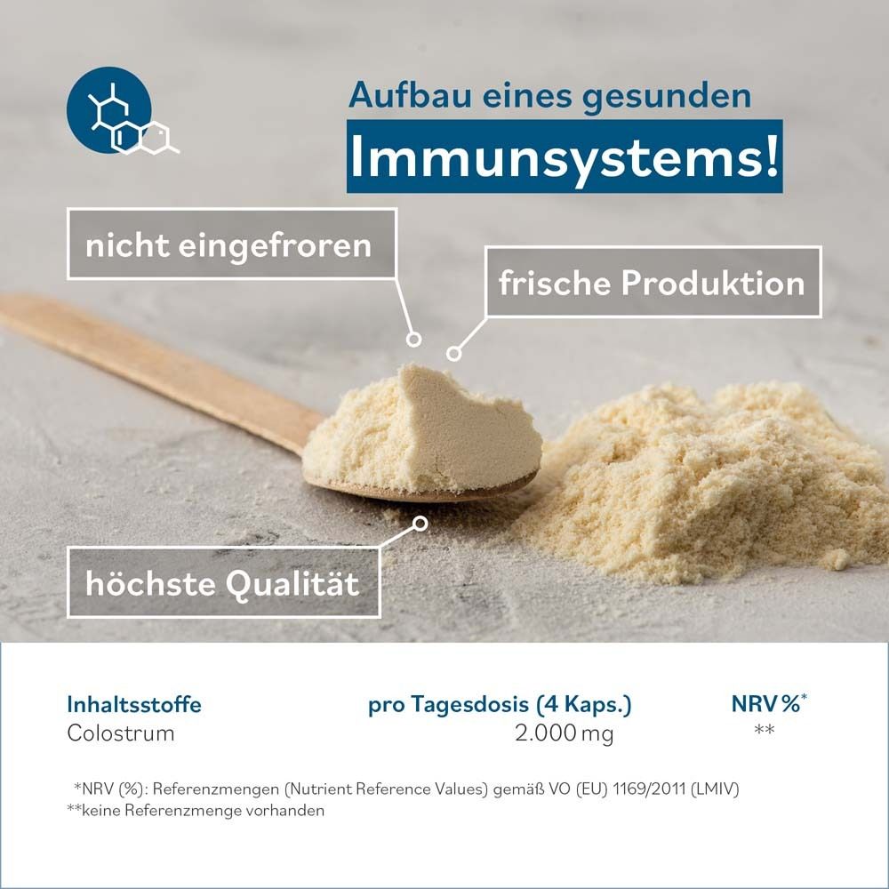 Cuillère en bois avec poudre de colostrum. Texte: Construire un système immunitaire sain ! 2 000 mg par dose quotidienne.