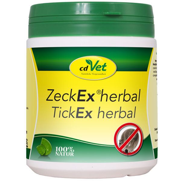 Boîte blanche et verte avec couvercle. Inscription : cd Vet ZeckEx herbal. Image d'une tique dans un cercle rouge. 100% naturel.