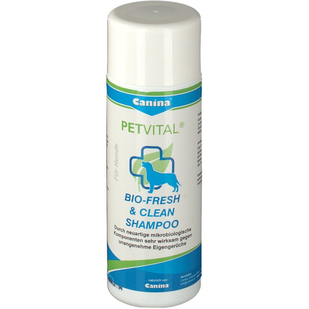 Weiße Flasche mit blau-grüner Banderole. Aufschrift: Canina PETVITAL BIO-FRESH & CLEAN Shampoo. Logo: Hund im Kreuz.