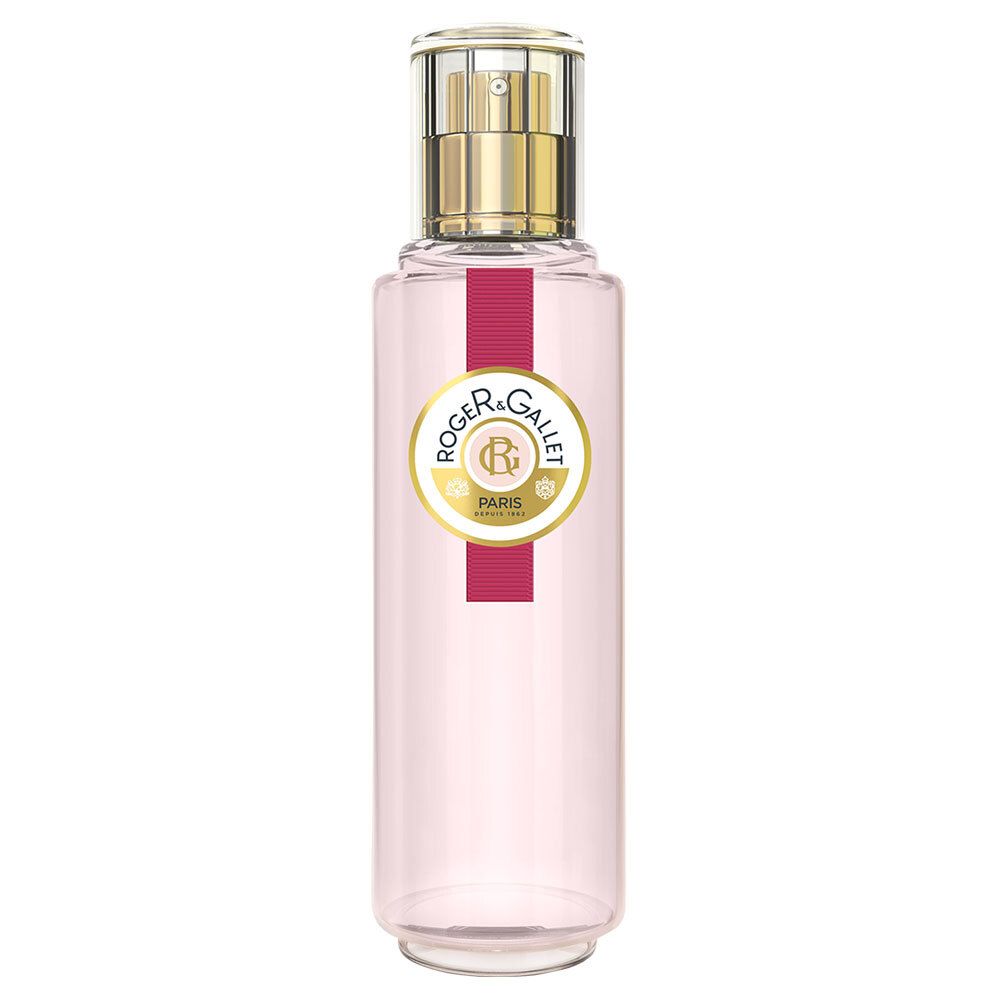 Flacon d'Eau Fraîche Rose. Forme cylindrique, liquide rose. Tête de pulvérisation dorée. Étiquette avec logo et texte ROGER & GALLET PARIS.