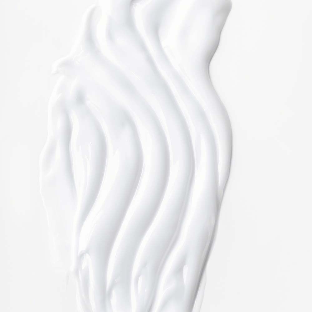 Émulsion blanche, en forme de vagues sur fond blanc.