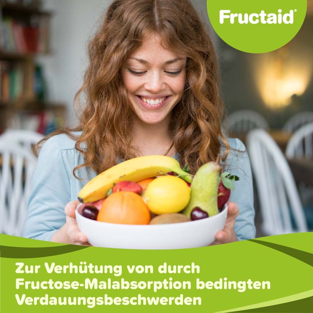 Femme tenant un bol de fruits. Logo Fructaid en haut à droite. Texte en bas: 'Zur Verhütung von...'.