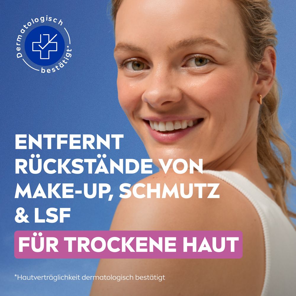 Frau mit strahlender Haut, NIVEA Tücher entfernen Make-up, Schmutz und LSF für trockene Haut.