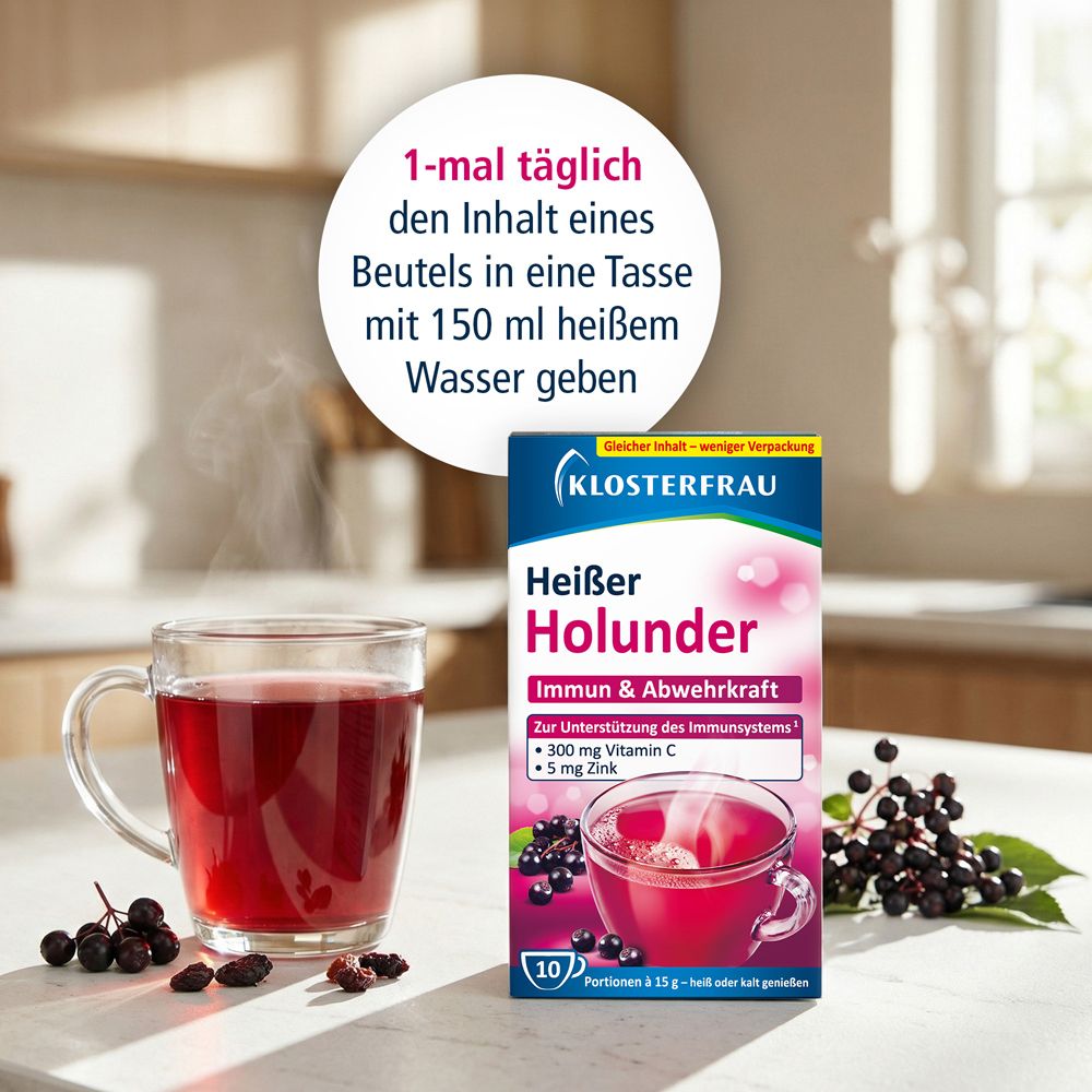 Tasse en verre avec boisson rouge, à côté boîte KLOSTERFRAU Heißer Holunder. Texte : 1 fois par jour contenu dans une tasse avec 150 ml d'eau chaude.
