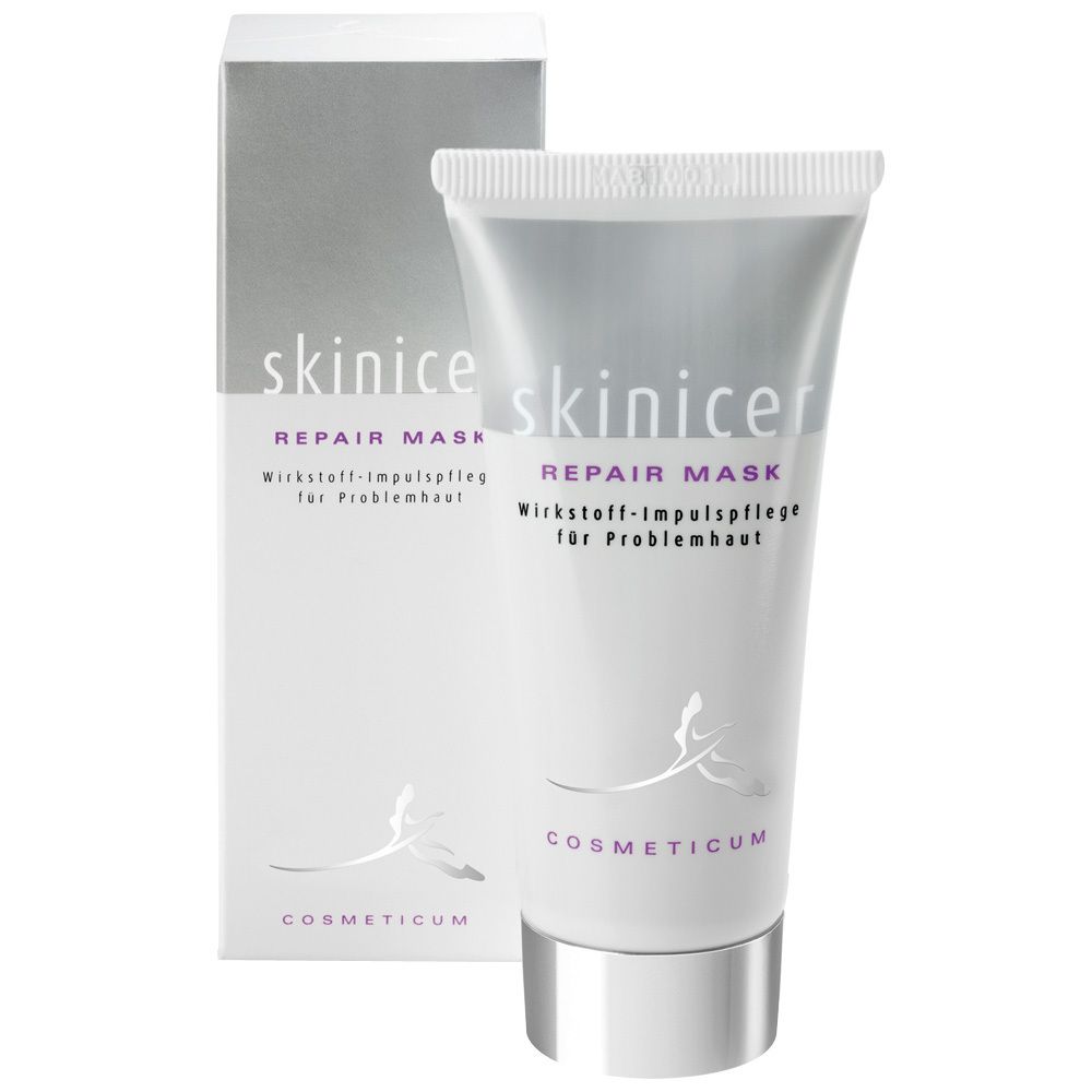 Tube et boîte skinicer® Repair Mask. Inscriptions blanches, argentées et violettes. Marque: COSMETICUM.