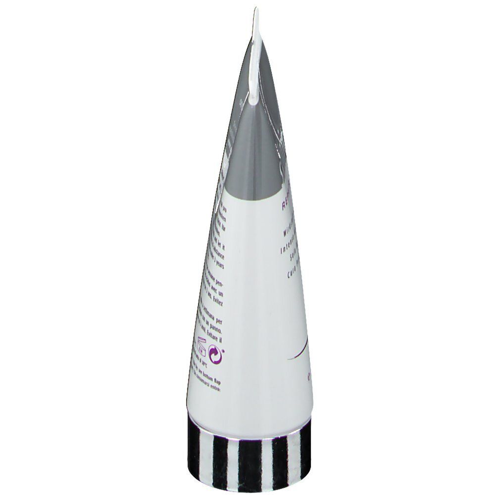 Vue oblique du tube skinicer® Repair Mask. Blanc, argent, anneau noir à la base. Texte au dos.