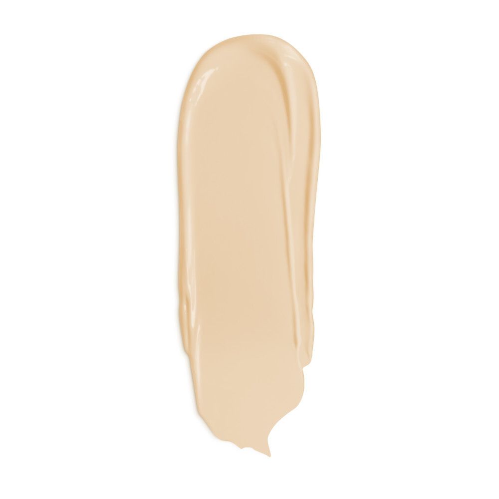 Crème solaire étalée. Teinte: beige clair.