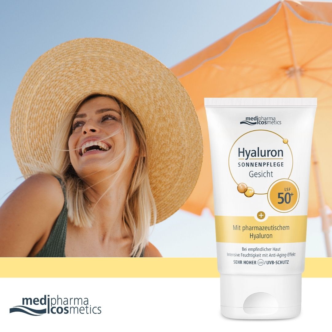 Frau mit Sonnenhut und Tube. Tube: Hyaluron Sonnenpflege Gesicht LSF 50+. Marke: medipharma cosmetics.