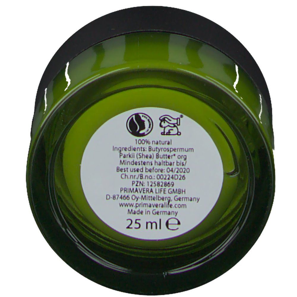 Unterseite eines grünen Glasbehälters mit Produktinformationen und Logo.