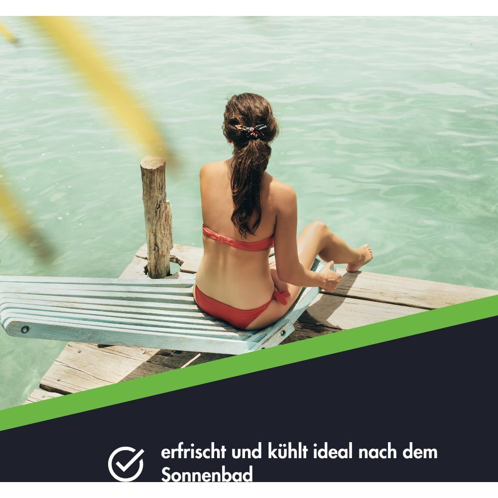 Frau entspannt am Wasser nach dem Sonnenbad.