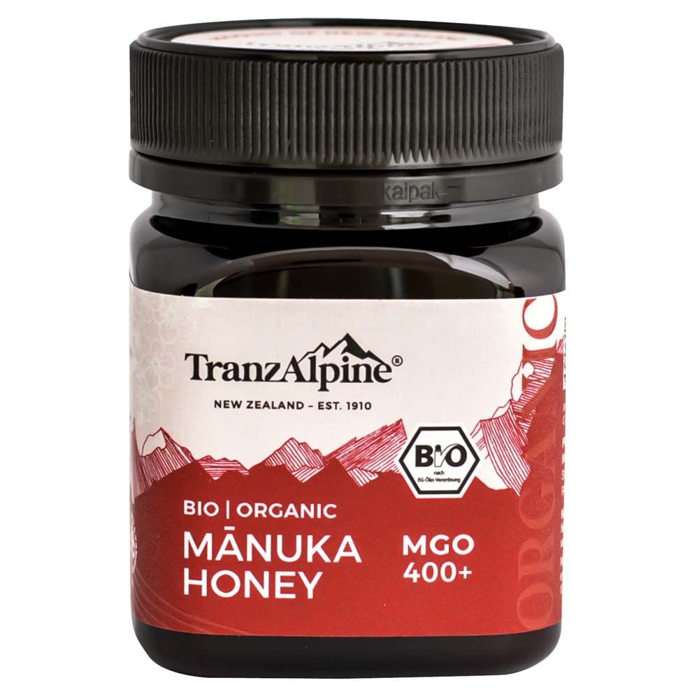 Pot de miel de Manuka bio 400+. Couvercle noir, étiquette avec logo, montagnes, texte: Bio, Organic, Mānuka Honey, MGO 400+.