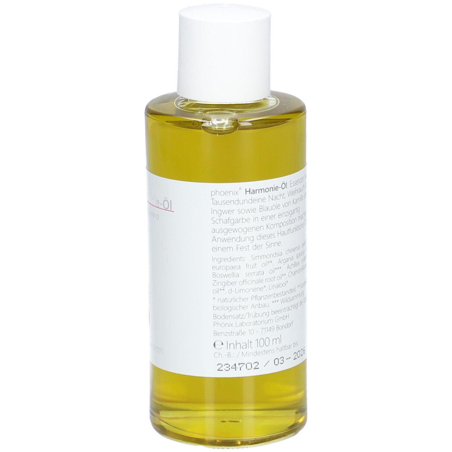 Flacon en verre avec bouchon blanc. Étiquette avec texte, ingrédients et logo. Liquide jaunâtre. 100 ml.