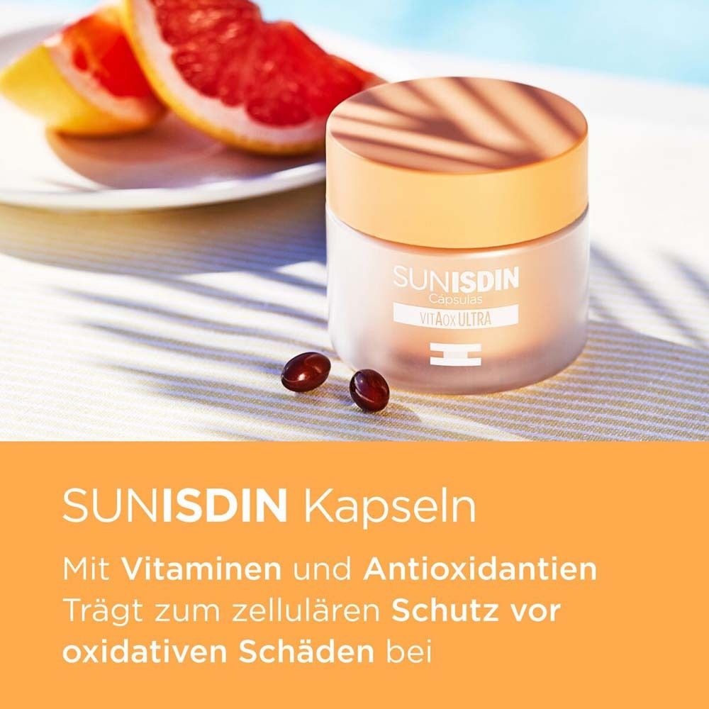 Behälter mit SunISDIN Kapseln und Grapefruit. Text: SunISDIN Kapseln, mit Vitaminen und Antioxidantien.