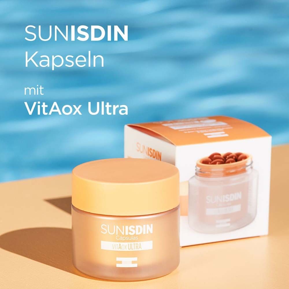 Behälter mit SunISDIN Kapseln und Verpackung. Text: SunISDIN Kapseln mit Vitaox Ultra. Kapseln sichtbar.
