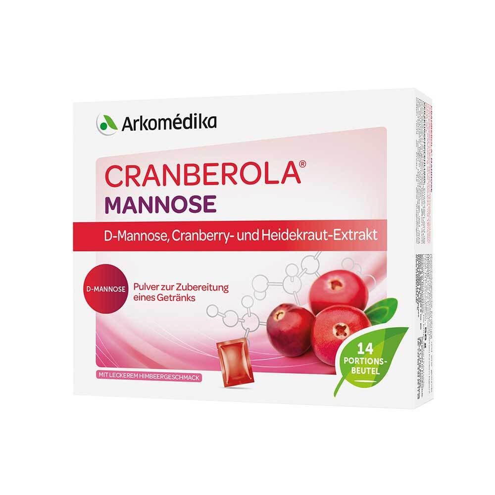 Weiße Schachtel mit Cranberola Mannose. Enthält 14 Portionen. Abbildung von Cranberrys und einem Beutel.