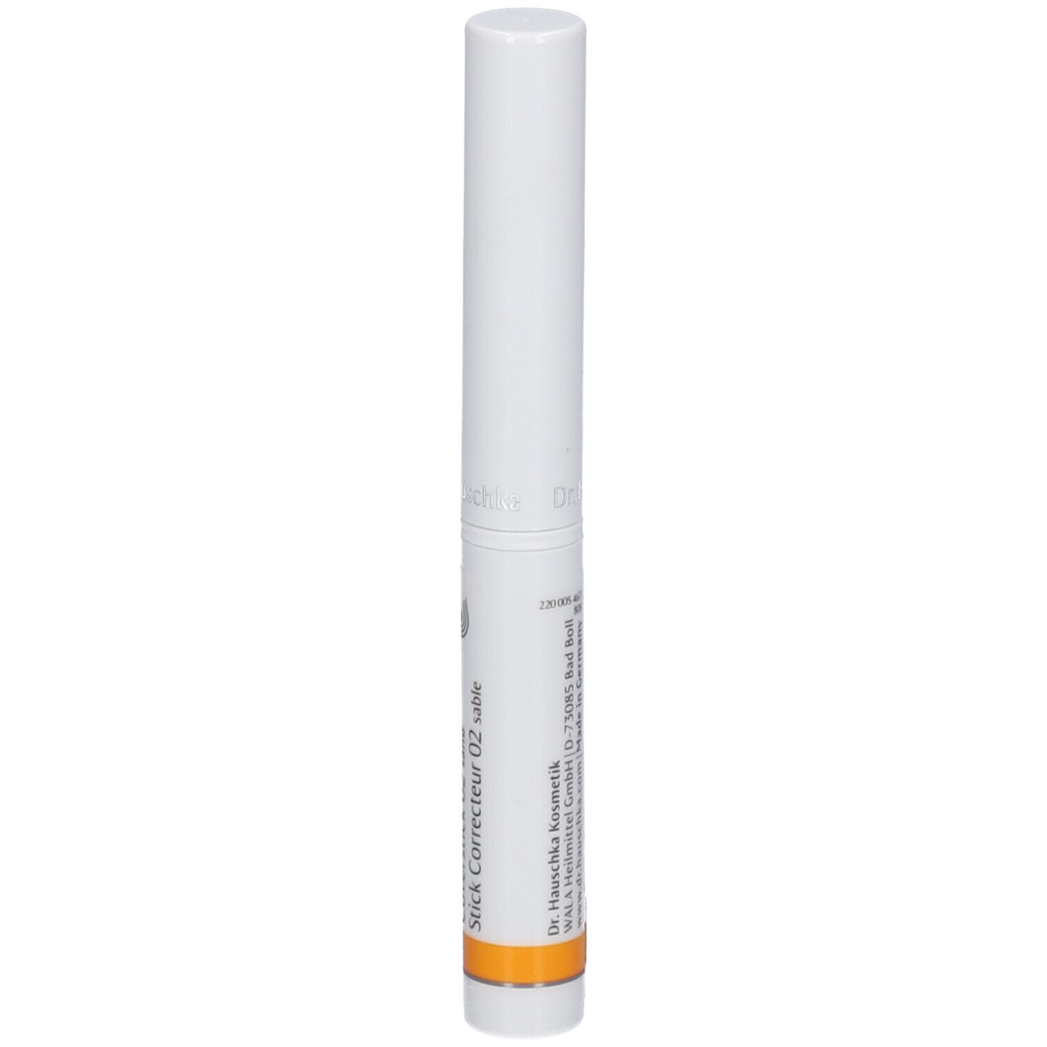 Bâton blanc avec bande orange. Inscription : Stick Correcteur 02 sable. Informations fabricant.