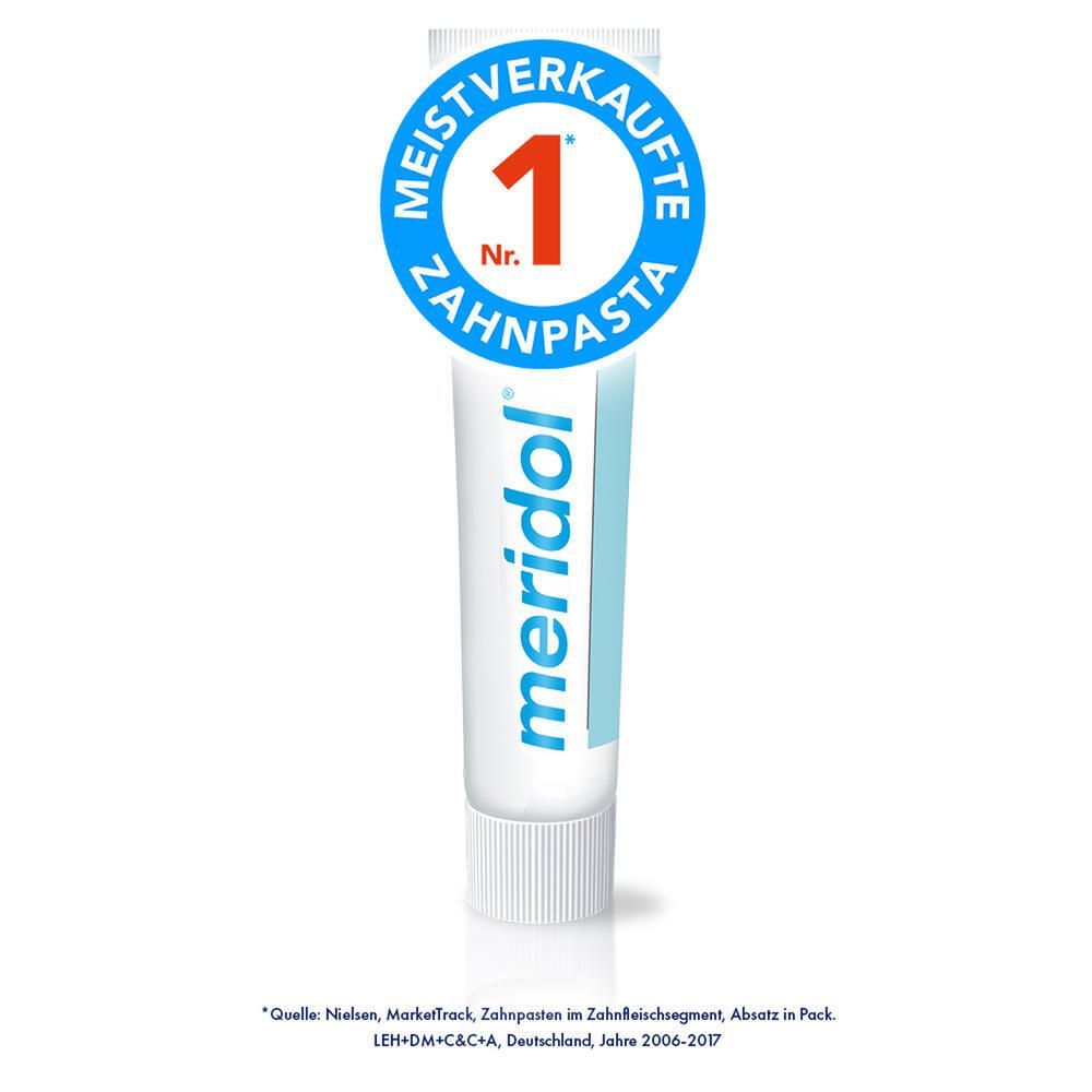 Tube de dentifrice avec logo et inscription 'N° 1 Dentifrice'. Couleurs bleu et blanc. Autocollant : 'Le plus vendu'.