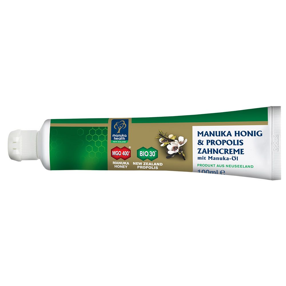 Tube de dentifrice. Vert, blanc et or. Texte : MANUKA HONIG & PROPOLIS ZAHNCREME. Marque : MANUKA HEALTH.