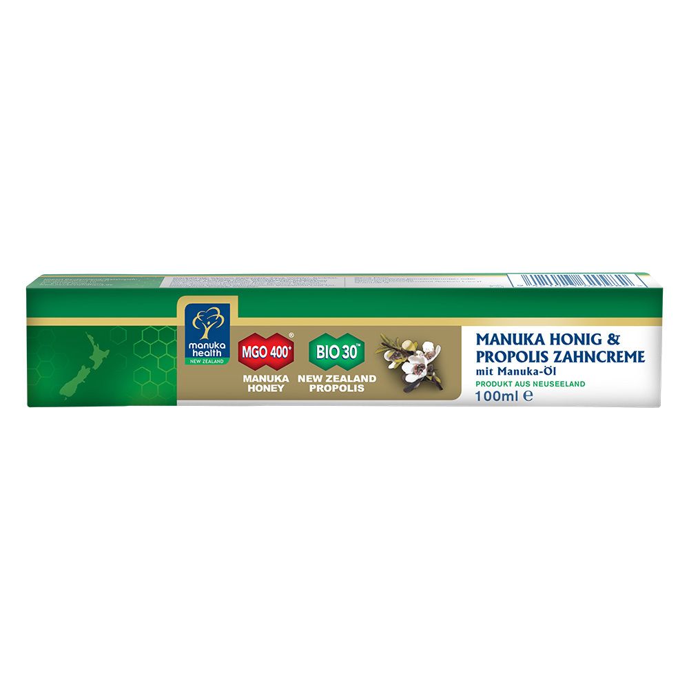 Emballage de dentifrice. Vert, blanc et or. Texte : MANUKA HONIG & PROPOLIS ZAHNCREME. Marque : MANUKA HEALTH.
