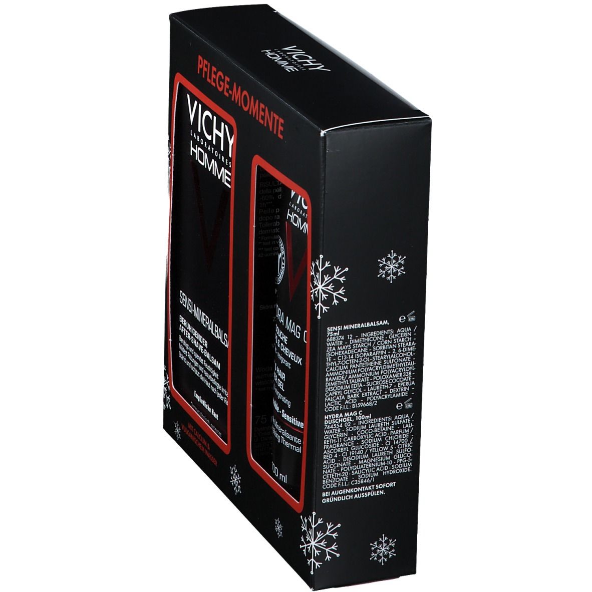 Boîte cadeau noire, vue latérale. Logo Vichy Homme et noms des produits. Décoration flocons de neige. Texte en allemand. Deux produits visibles.
