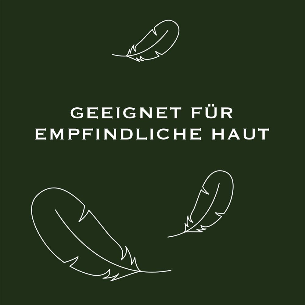 Fond vert foncé avec plumes blanches et texte : Convient aux peaux sensibles.