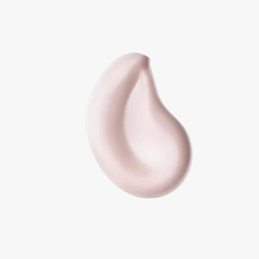 Goutte de crème rose. Sur fond blanc.