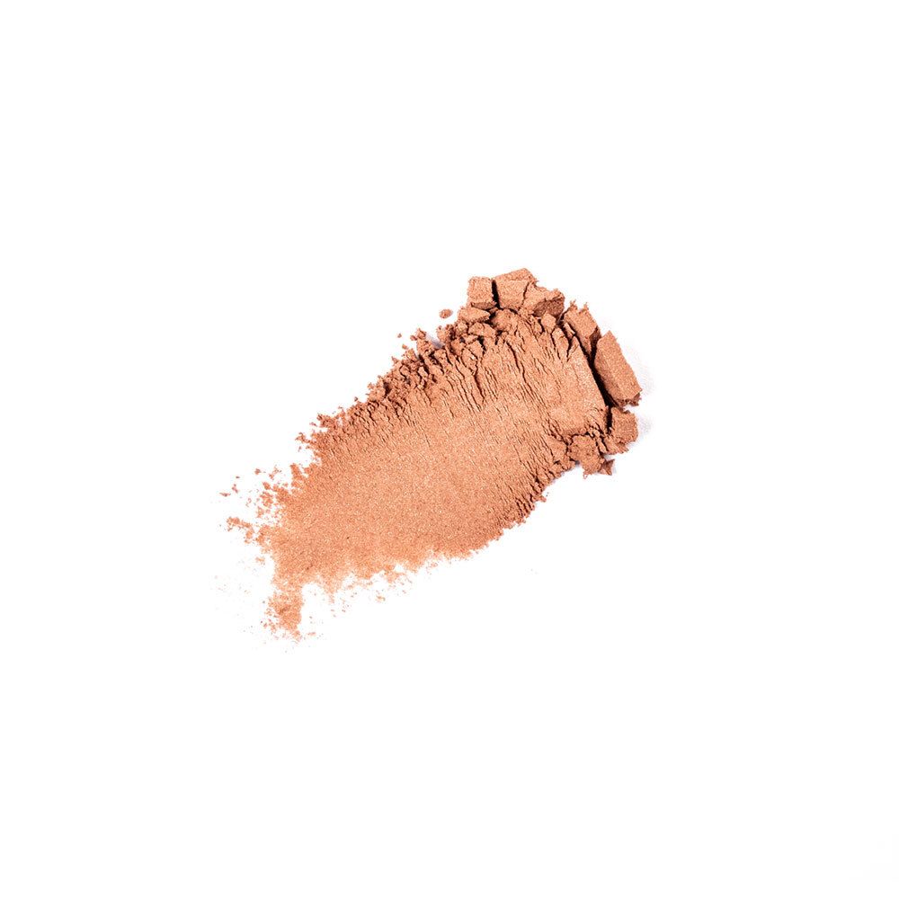 Heller Bronzer-Abstrich auf weißem Hintergrund. Bräunliche Farbe.
