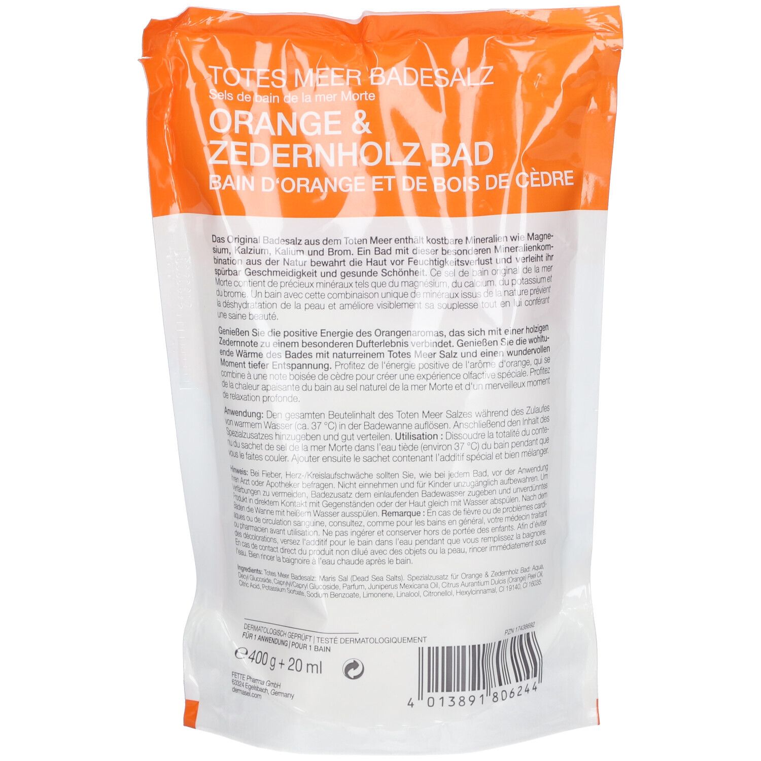 Dos de l'emballage de sel de bain DERMASEL®. Informations textuelles sur fond blanc. Bande orange en haut.