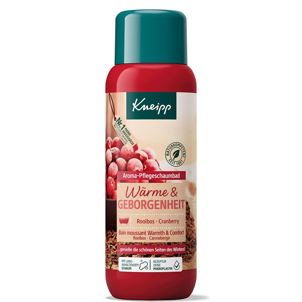 Rote Flasche mit grünem Deckel. Aufschrift: Aroma-Pflegeschaumbad Wärme & Geborgenheit. Cranberry-Motiv. Naturkosmetik-Siegel.