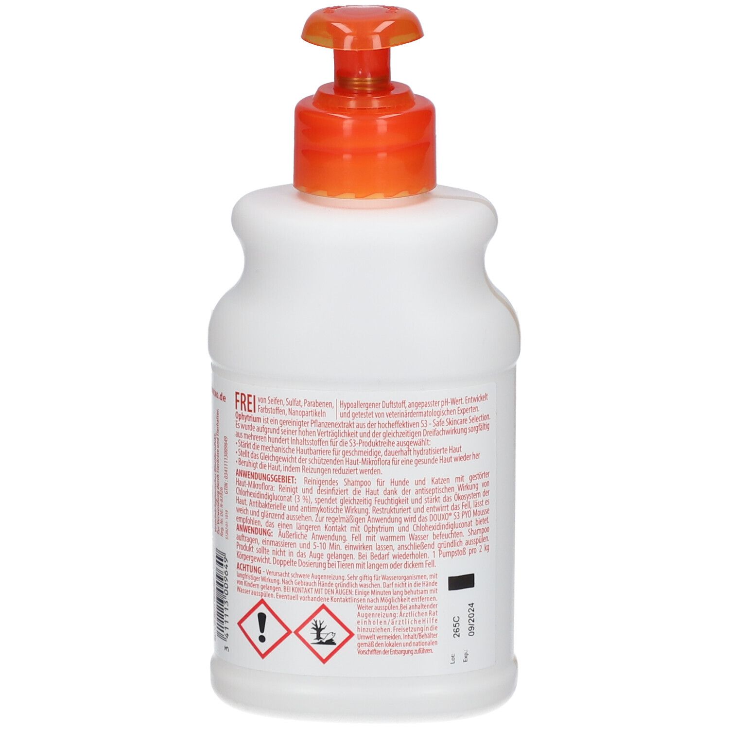 Weiße Flasche mit orangefarbenem Pumpkopf. Rückseite mit Text, Warnsymbolen und Verfallsdatum. Der Pumpkopf ist nach links gerichtet.