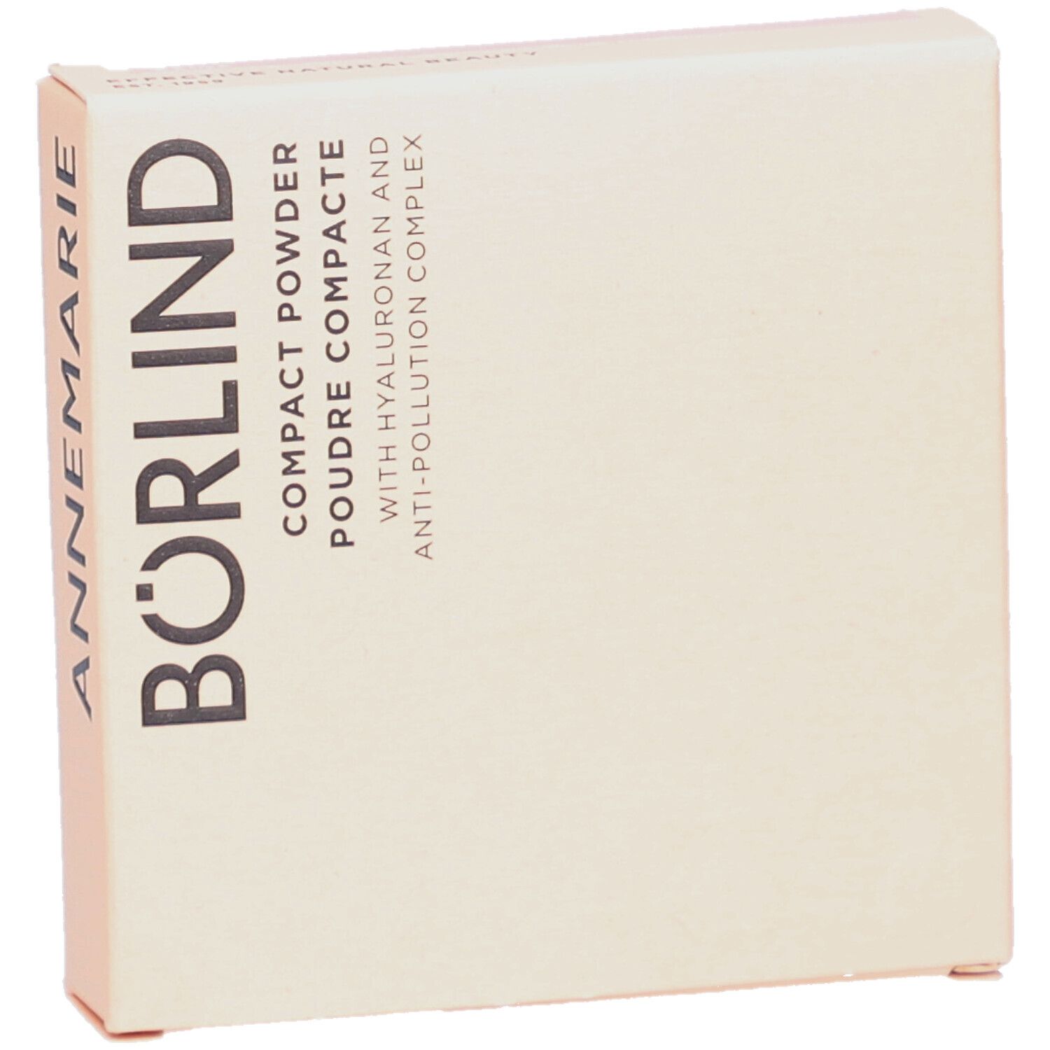Kompaktpuder-Verpackung. Beige Karton mit Schriftzug ANNEMARIE BÖRLIND. Text: Compact Powder, Poudre Compacte, mit Hyaluron und Anti-Pollution Complex.