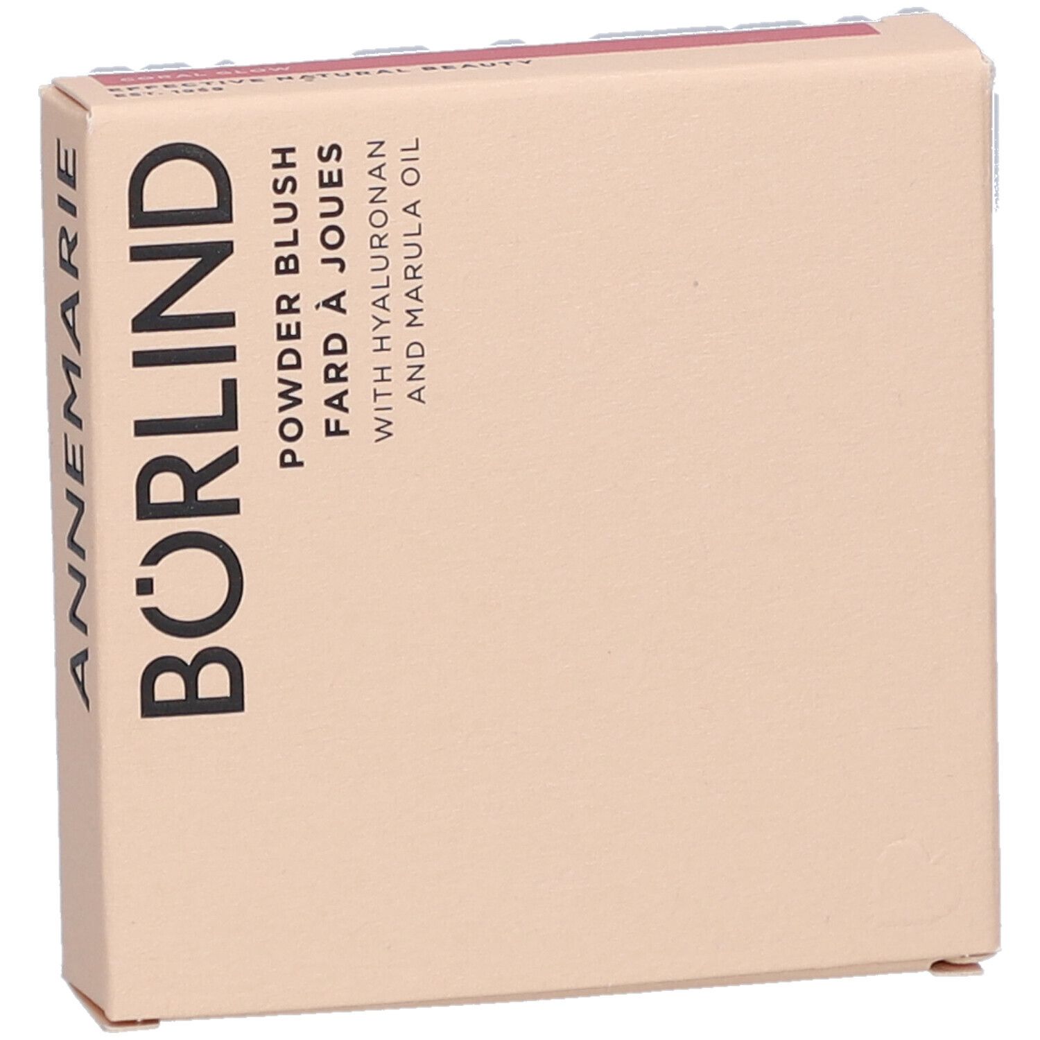 Boîte en carton avec le nom ANNEMARIE BÖRLIND. Inscription : Powder Blush, Fard à Joues, avec Hyaluronan et huile de Marula. Beige et rose.
