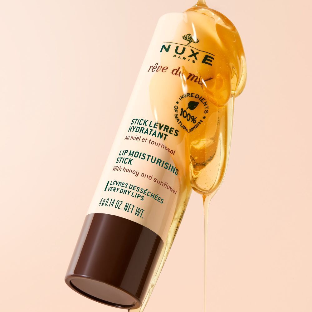 Stick lèvres NUXE Rêve de Miel®. Miel qui coule. Beige et marron. Ingrédients 100% naturels. Texte visible.