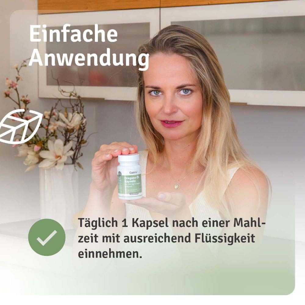 Frau hält Flasche mit Oregano Öl Kapseln. Text: Einfache Anwendung. Täglich 1 Kapsel. Marke: Casida®.