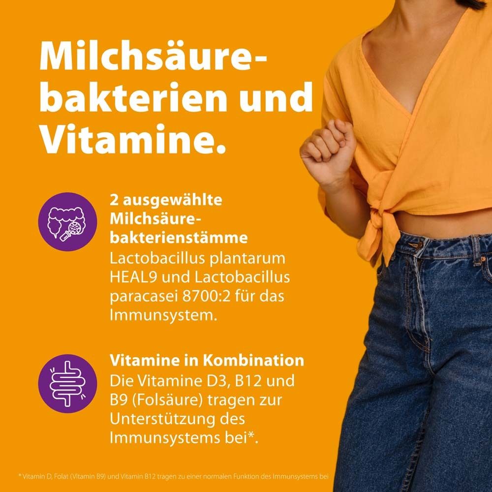 Texte: Bactéries lactiques et vitamines. 2 souches de bactéries lactiques. Vitamines D3, B12, B9 (acide folique) pour soutenir l'immunité.
