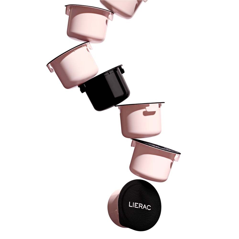 Plusieurs recharges roses et un couvercle noir. Certaines avec couvercle, d'autres sans.