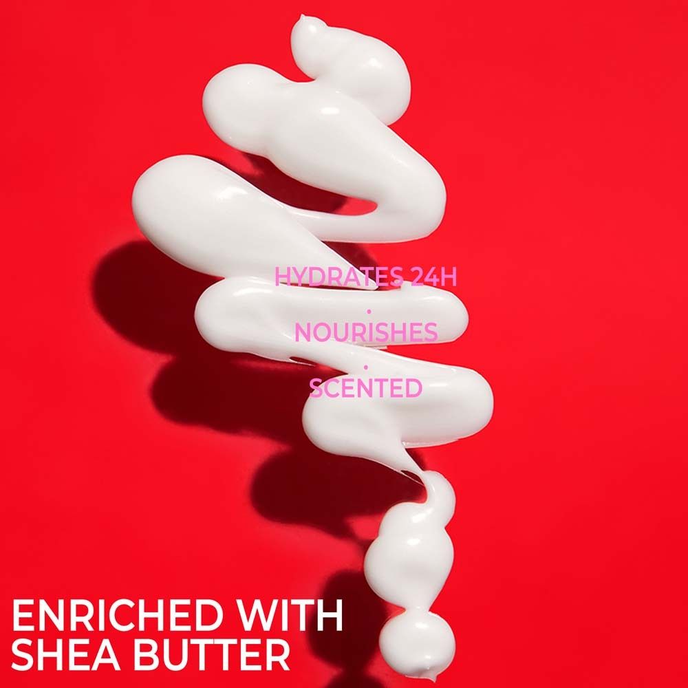 Produit blanc sur fond rouge. Texte: HYDRATES 24H, NOURISHES, SCENTED. ENRICHED WITH SHEA BUTTER.